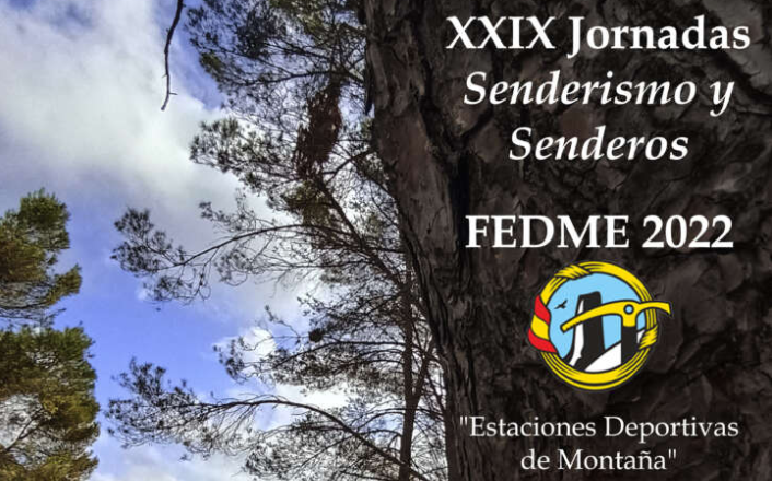 Descripción Foto de portada: Cartel, a todo color, de las XXIX Jornadas de Senderismo y Senderos. Presenta una foto donde aparece, en primer plano, una marca de PR® sobre el tronco de un pino, junto a una barranquera; como fondo aparece un puente sobre la misma y detrás de todo se visualiza una torre sobre un cerro. Sobreimpreso aparece la leyenda que describe el evento, las fechas, la referencia para inscripciones y los logos.